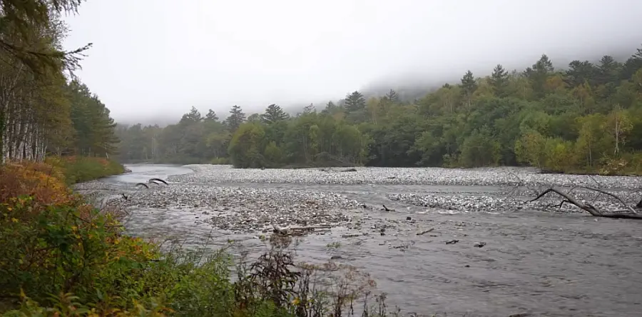 The Azusa River winding through misty Kamikochi valley